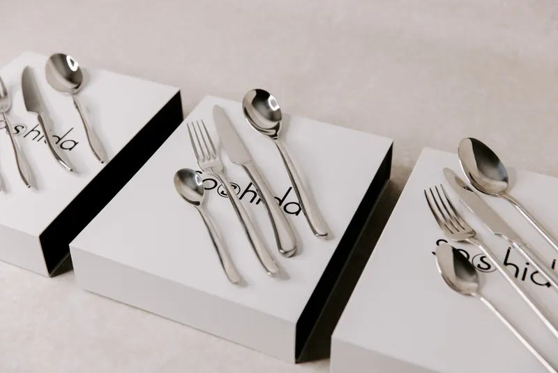 Soshida stainless steel cutlery sets laid out on their white gift boxes